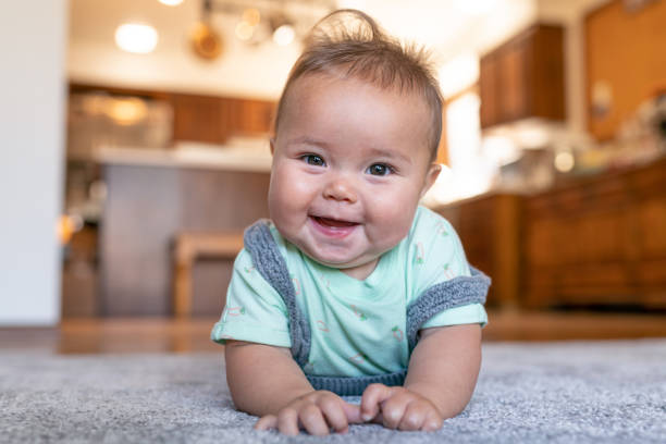 Baby laying on carpet flooring | Leicester Flooring