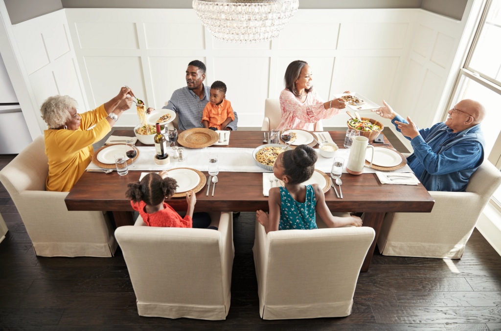 Family having breakfast at the dining table | Leicester Flooring