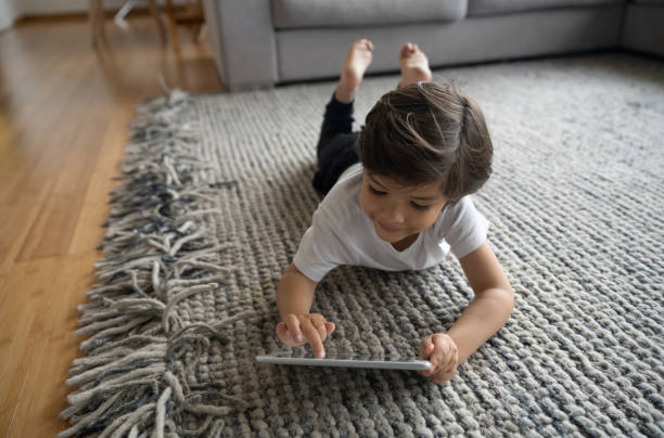 Cute girl laying on carpet floor | Leicester Flooring